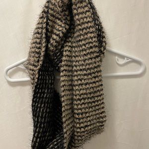 Simply Noelle infinity knit scarf. Acrylic and nylon based. Tan and black